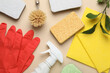 Flat lay composition with sponges and other cleaning supplies on beige background