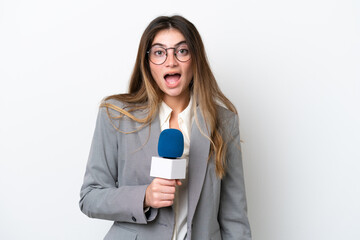 Young caucasian TV presenter woman isolated on white background with surprise facial expression