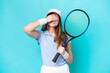 Young tennis player woman isolated on blue background covering eyes by hands. Do not want to see something