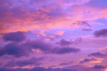 Wall Mural - purple orange pink sunset. beautiful evening sky with clouds background for design.