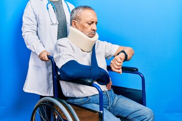 Canvas Print - Handsome senior man with beard sitting on wheelchair with neck collar checking the time on wrist watch, relaxed and confident