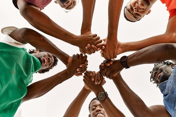 Sticker - Group of young african american artist man smiling happy and holding hands together at art studio.