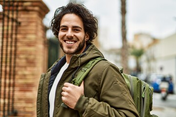 Sticker - Handsome hispanic man smiling at the city