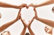 © Krakenimages.com - Group of young friends with hands together doing heart symbol.