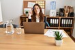 © Krakenimages.com - Young hispanic woman business worker using laptop working at office