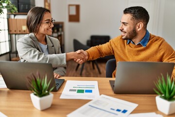 Canvas Print - Two business workers shaking hands at the office.