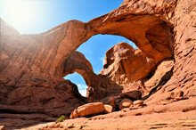 Double Arch, The Windows, Arches National Park, Utah, USA. Desert Rock Formation Under Sunny Blue Skies.