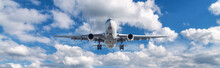 Airplane Is Flying In Clouds At Sunny Day In Summer. Landscape With Passenger Airplane, Blurred Blue Sky. Aircraft Is Taking Off. Business Travel. Commercial Plane. Transport. Private Jet