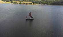 An Aerial View Of An Old Thames Sailing Barge On The River Orwell In Suffolk, UK