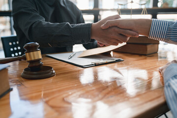 Wall Mural - lawyer or judge shaking hands after agreeing to accept a bribe From businessman to lawsuit to win legal, illegal bribery, bribery and corruption concept.