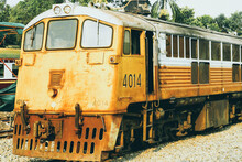 Yellow Train, Thailand Train. Procession Yellow Train Led By Diesel Electric Locomotive On The Tracks From Thailand