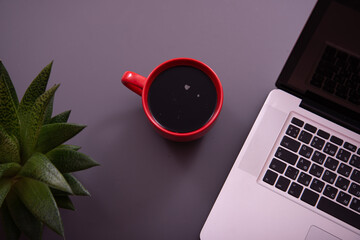 Items on the table. Studying and working with a laptop and a notebook. Early morning and coffee.	