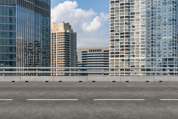 Empty urban asphalt road exterior with city buildings background. New modern highway concrete construction. Concept of way to success. Transportation logistic industry fast delivery. Chicago. USA.