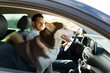 Happy man driving with his dog