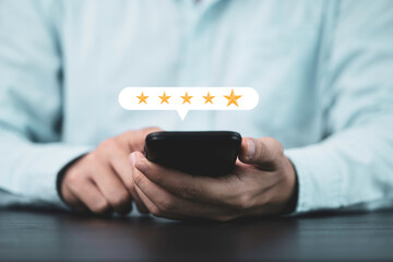 Poster - Businessman holding smartphone to give five yellow stars , Excellent customer satisfaction and evaluation for good quality product and service concept.