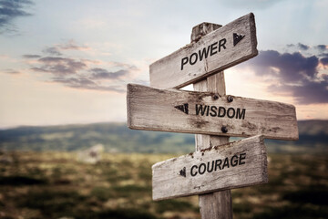 Sticker - power wisdom courage text quote caption on wooden signpost outdoors in nature. Stock sign words theme.