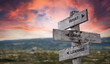 what i have learned text quote caption on wooden signpost outdoors in nature with dramatic sunset skies. Panorama crop.