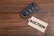 Car Auction concept. Vehicle security key with tag on the