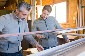 carpentry supervisor inspecting finish product