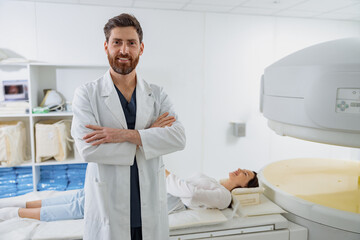 Wall Mural - Radiologist on background of MRI or CT or PET Scan with female patient undergoing procedure