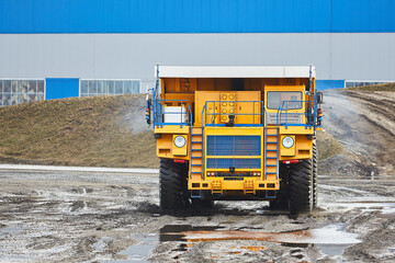 Wall Mural - Large quarry dump truck. Big yellow mining truck at work site. Production useful minerals