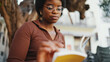 African American girl in glasses looking serious reading book ou
