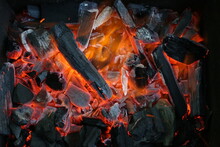 Charcoal Is Smoldering In The Grill For Cooking. Ashes, Heat, Smoke And Fire Of Coals. Burning Background