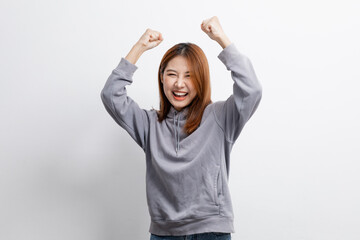 Wall Mural - Portrait of beautiful Asian woman doing cheerful pose on isolated background, portrait concept used for advertisement and signage, isolated over white background, copy space.