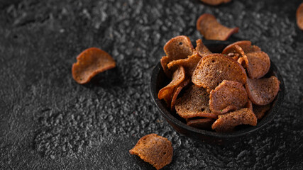 Garlic dark bread crisps, finger party food, beer snack