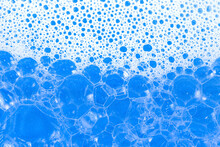 Soap Foam. Background Of Dusty Foam With Bubbles Of Blue Color For An Inscription. Soap Sud With Copy-space