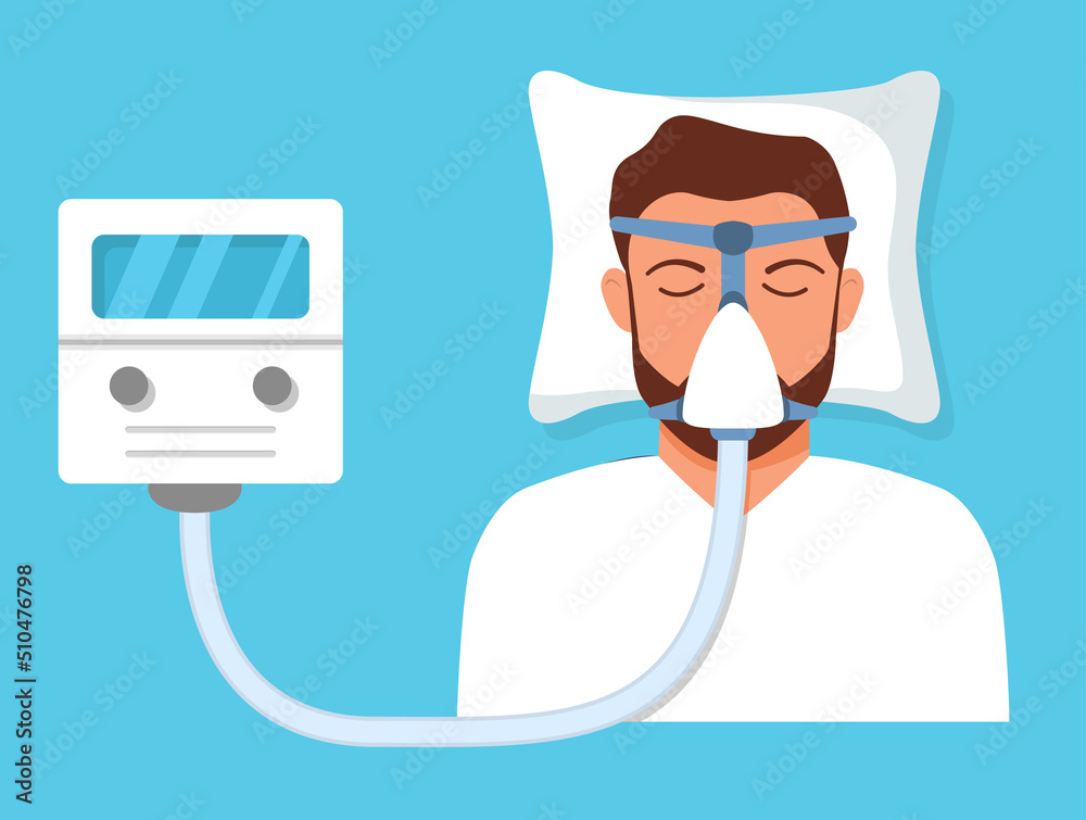 Continuous positive airway pressure.Obstructive sleep apnea. Man lying ...