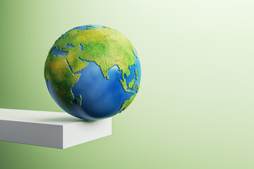 Poster - Abstract image of globe on edge of white block trampoline and mock up place on green background. 3D Rendering.