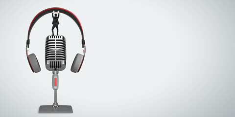 Poster - Podcasting and radio concept with man in black suit carrying headphones staying on retro microphone on light blank background with space for your logo or text, mockup