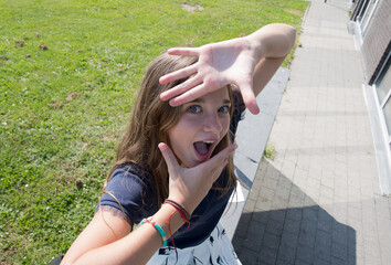 blond teenage girl grimaces and makes faces at camera,children's entertainment