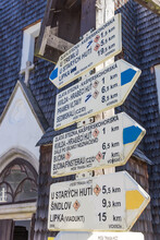 Tourist Sign In Front Of The Church Of Kvilda, Czech Republic