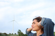 © Antonioguillem - Annoyed woman suffering windmill noise in a wind farm