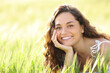 © Antonioguillem - Happy woman with perfect smile in a wheat field