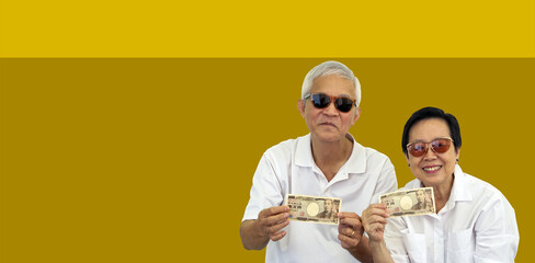 Wall Mural - Asian senior couple holding cash money investment profit retirement benefit