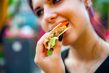 Wall Mural - woman eat taco outdoor traditional in mexican food. street food