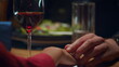 © stockbusters - Love couple holding hands at romantic restaurant dinner date. Intimate concept.