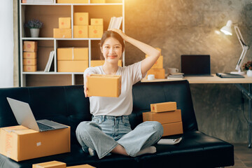 Wall Mural - Asian woman working in modern warehouse and delivery service via modern technology