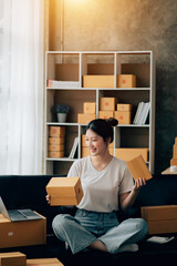 Wall Mural - Asian woman working in modern warehouse and delivery service via modern technology