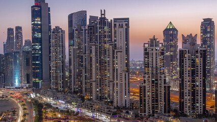 Bay Avenue with modern towers residential development in Business Bay aerial day to night timelapse, Dubai