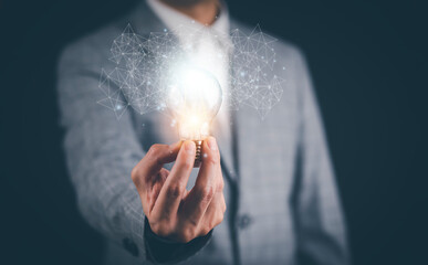 Poster - Creativity in the hands of business people idea concept, Businessman holding glowing light bulb with drawing brain and connection line, creative thinking ideas and innovation technology and creativity