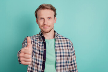 Wall Mural - Photo of promoter man raise thumb up approve solution decision choice wear checkered shirt on teal color background