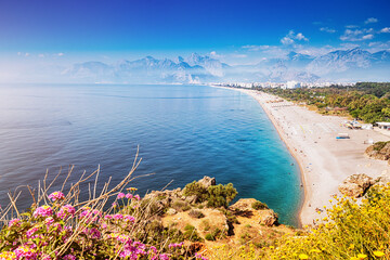 Wall Mural - Famous Konyaalti beach, scenic panoramic view from a cliif top. Travel destinations of Turkey and Antalya and mediterranean riviera