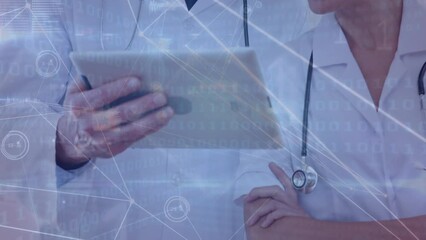 Canvas Print - Animation of diverse male and female doctors using tablet over data processing