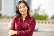 Modern businesswoman crossed her hands on the outside. pretty young asian woman smiling. business concept