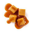 Caramel cubes with caramel sauce isolated on white background. Top view of caramel cubes