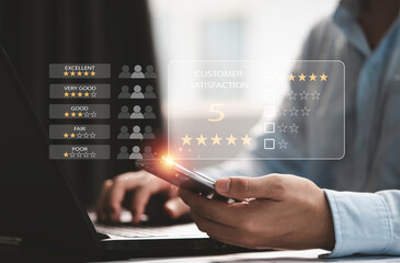 Poster - Customer satisfaction survey concept, Businessman using computer laptop and smartphone to select excellent yellow five stars to evaluate product and service.